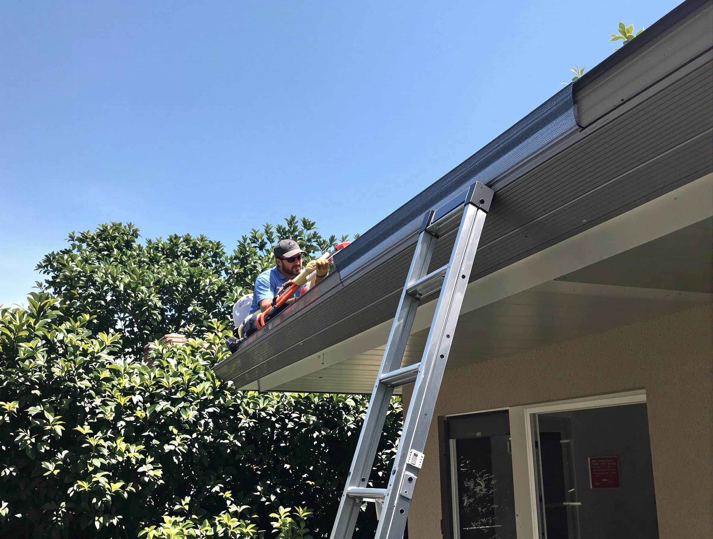 Garfield Heights Roofing Company installing gutter guards for a homeowner in Garfield Heights, OH